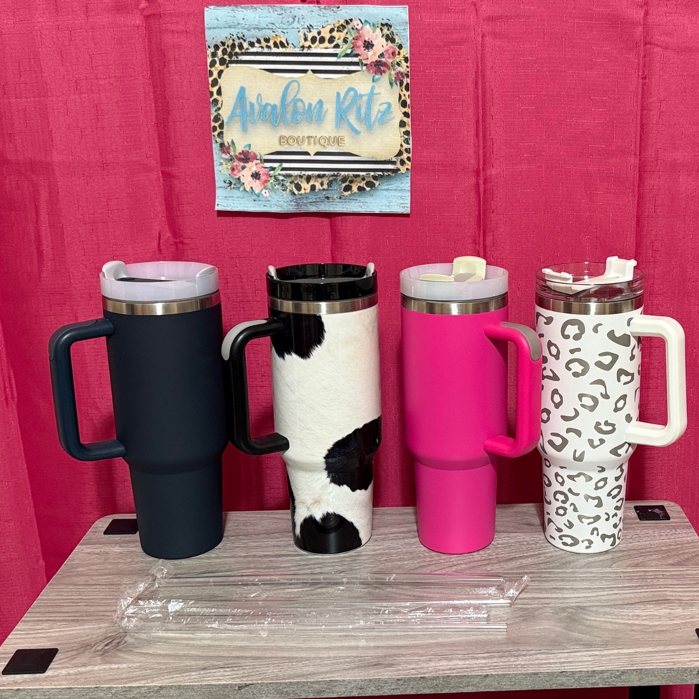 Stylish Insulated Tumblers Set - Dark Blue, Cow Print, Pink, and Leopard.